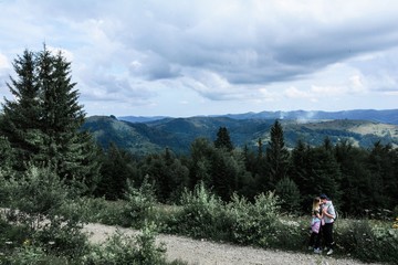 Fototapeta na wymiar guy and girl in the mountains forest Carpathians beautiful