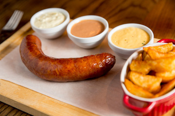 Sausage and potatoes with sauces