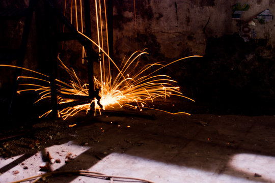 Sparks Falling Outdoors At Night