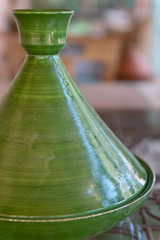 Green, traditional Moroccan ceramic tagine (tajine). Authentic, traditional expensive, high quality ceramic that can be used for cooking.