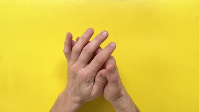 senior male wrings hands nervously