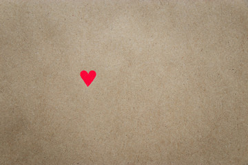Image of heart on beige craft paper background with copy space. Minimal think