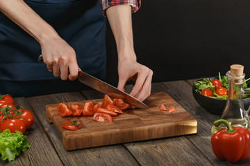 Woman cooking fresh vegetable salad. Female hands. Diet concept for healthy lifestyle with copyspace.