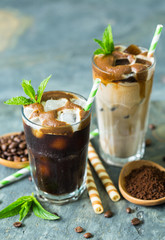 Delicious black and latte iced coffee in the glass