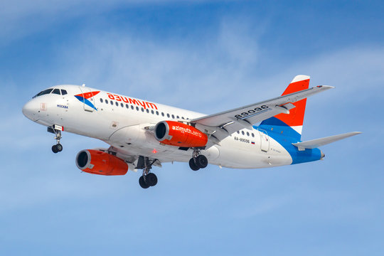 Moscow, Russia - March 14, 2019: Aircraft Sukhoi Superjet 100 RA-89096 of Azimuth Airlines going to landing at Vnukovo airport in Moscow on a blue sky background at sunny morning