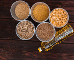Various cereals and a bottle of sunflower oil. Raw porridge, food supplies in the kitchen.