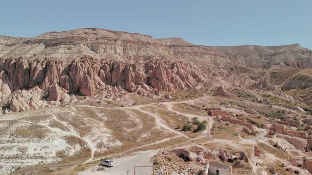 Aerial Drone flying over fairy chimneys through valleys in Cappadocia Nevsehir Turkey