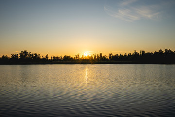Fototapeta na wymiar Sunset over the lake in the Biesbosch, The Netherlands.