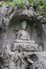 Fototapeta na wymiar Sculpture bouddhiste du temple de Lingyin à Hangzhou, Chine