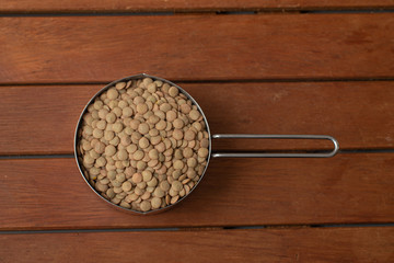 Pile of raw lentil in a Cup