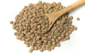 Pile of raw lentil in a spoon