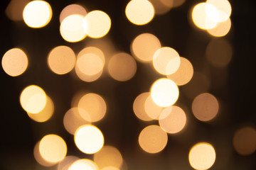 Obraz premium Abstract and blur for texture and background. Golden circle bokeh on black background. 