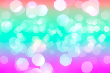 The white abstract bokeh on the colorful background.
