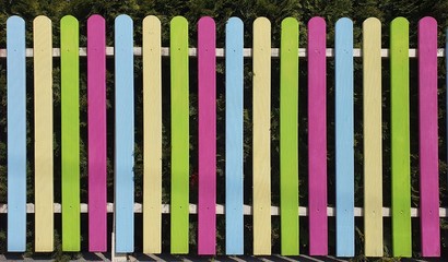 Colorful wooden fence made of vertical boards