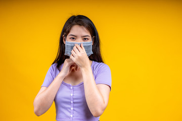 An Asian woman is wearing a health mask and promises not to approach her to prevent an outbreak of coronavirus or covid-19.