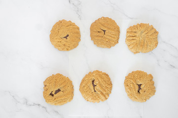 Group of homemade chocolate cookies and space for text on marble background