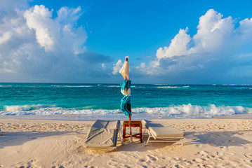 Tropical seascape with sunchair on the beach