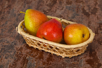 Pear heap in the wooden basket