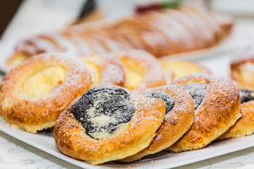 Delicious tasty fresh bakery products on table. Closeup