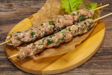 Raw minced pork skewer kebab for grill