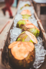 coconuts placed on ice in a wedding ceremony