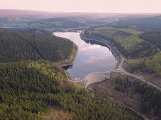 Aerial drone view of the Oker Dam in the forest of the Harz mountains in Lower Saxony, Germany....