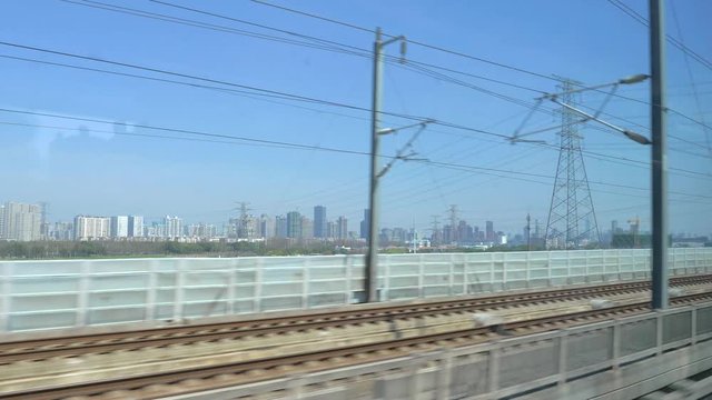 Chinese high speed train. View outside window of High Speed Train driving at 350 km/h