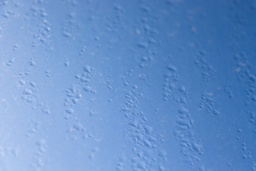 blue water drops on glass