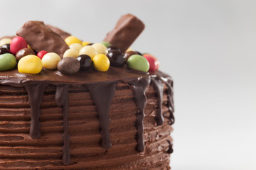 Drip chocolate cake on white background