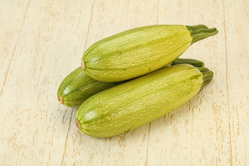 Young tasty zucchini over board