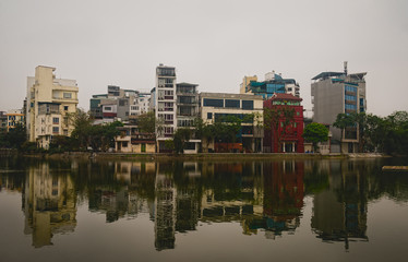 Fototapeta na wymiar Traditional vietnamese houses and reflection in Hanoi, Vietnam