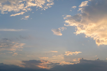 blue sky with golden orange cloud sunset