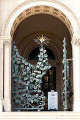 wrought-iron grille showing the vines, Pecs, HUngary