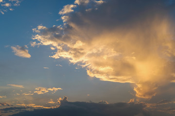 blue sky with golden orange cloud sunset