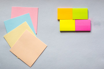 Colored sticky notes on a light background. The view from the top. Space for text. Horizontal photos.