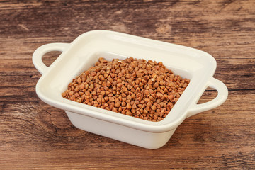 Raw buсkwheat cereal in the bowl
