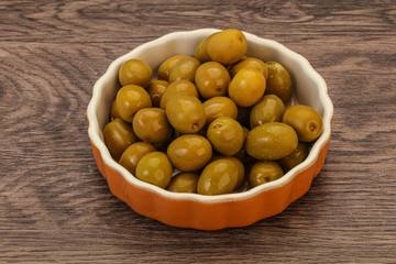 Green pickled olives in the bowl