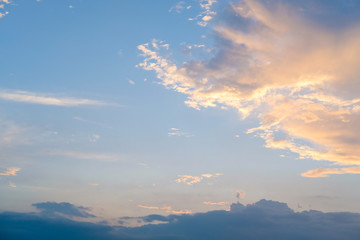blue sky with golden orange cloud sunset