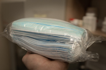 Packages with anti-virus and protecting masks intended for people during a coronavirus pandemic. COVID-19