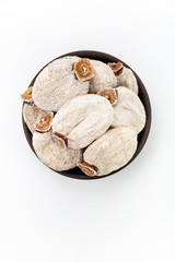 Dried Persimmon in round bowl on white background, top view