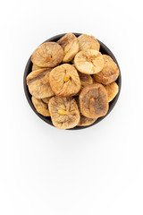 Dried apricots in round bowl on white background, top view