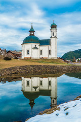 Seefeld Seekirchl Church with Water reflection in winter without snow