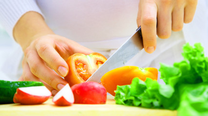 Male hands cutting vegetables