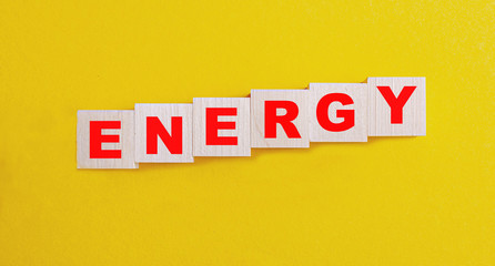 the word Energy, text made with dice on yellow background