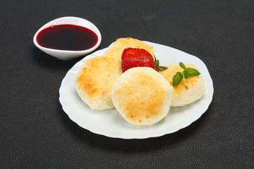 Curd pancakes with jam and stravberry