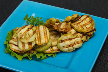 Grilled eggplant slices served basil