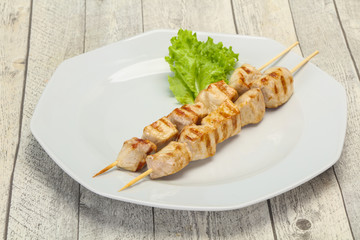 Grilled pork skewer served salad