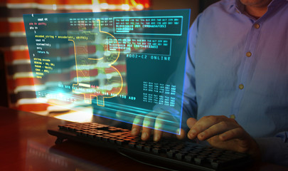 Bitcoin with typing on keyboard and cryptocurrency mining hologram screen