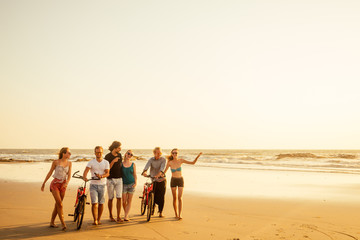 six friends meeting on the beach in Goa India and having time together