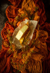 
Cheesecake on an orange background. Homemade pastries.